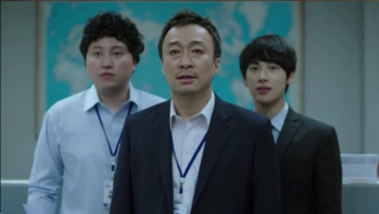 The three main actors from the TV Drama Misaeng staring in the direction of the camera