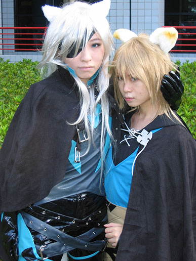 Cosplayers pose for a photograph